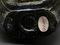 An Olive Green Glass Portrait Bust Flask