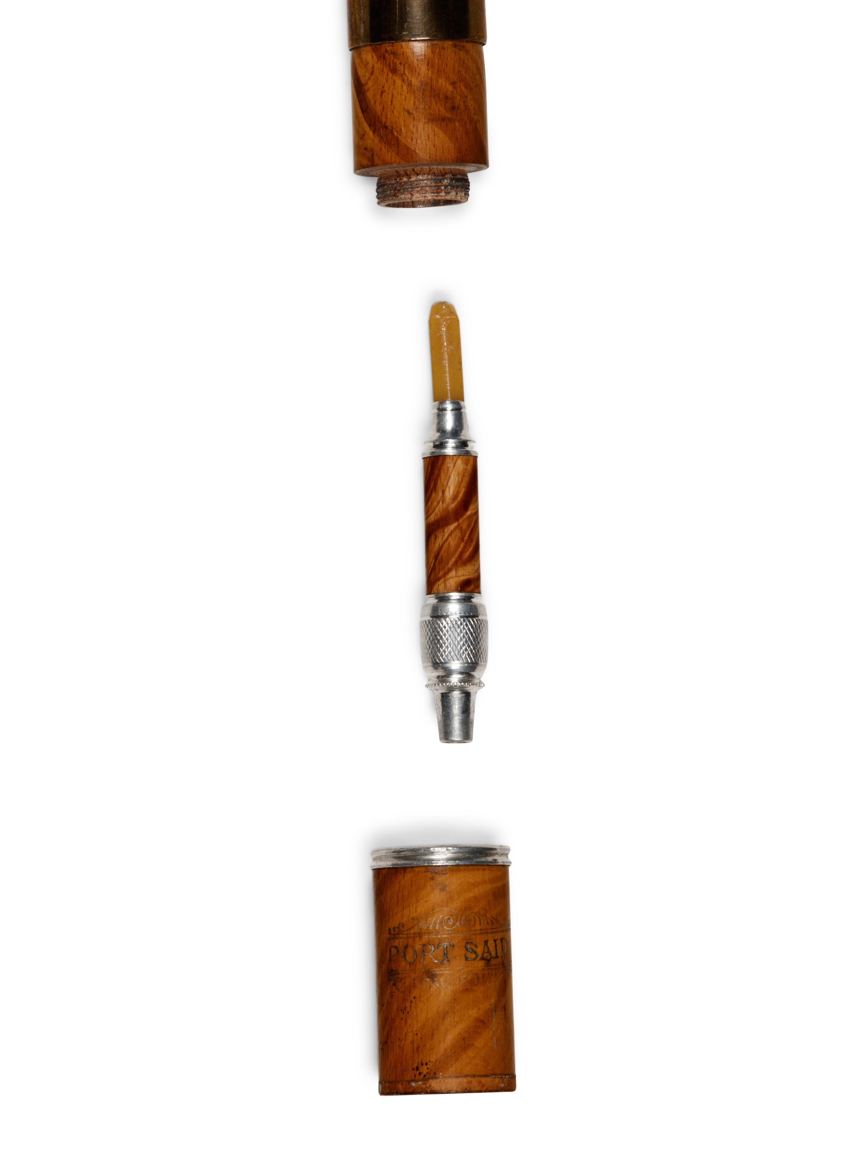 A Brass Mounted Walnut Souvenir Smoker's 'System' Walking Stick
