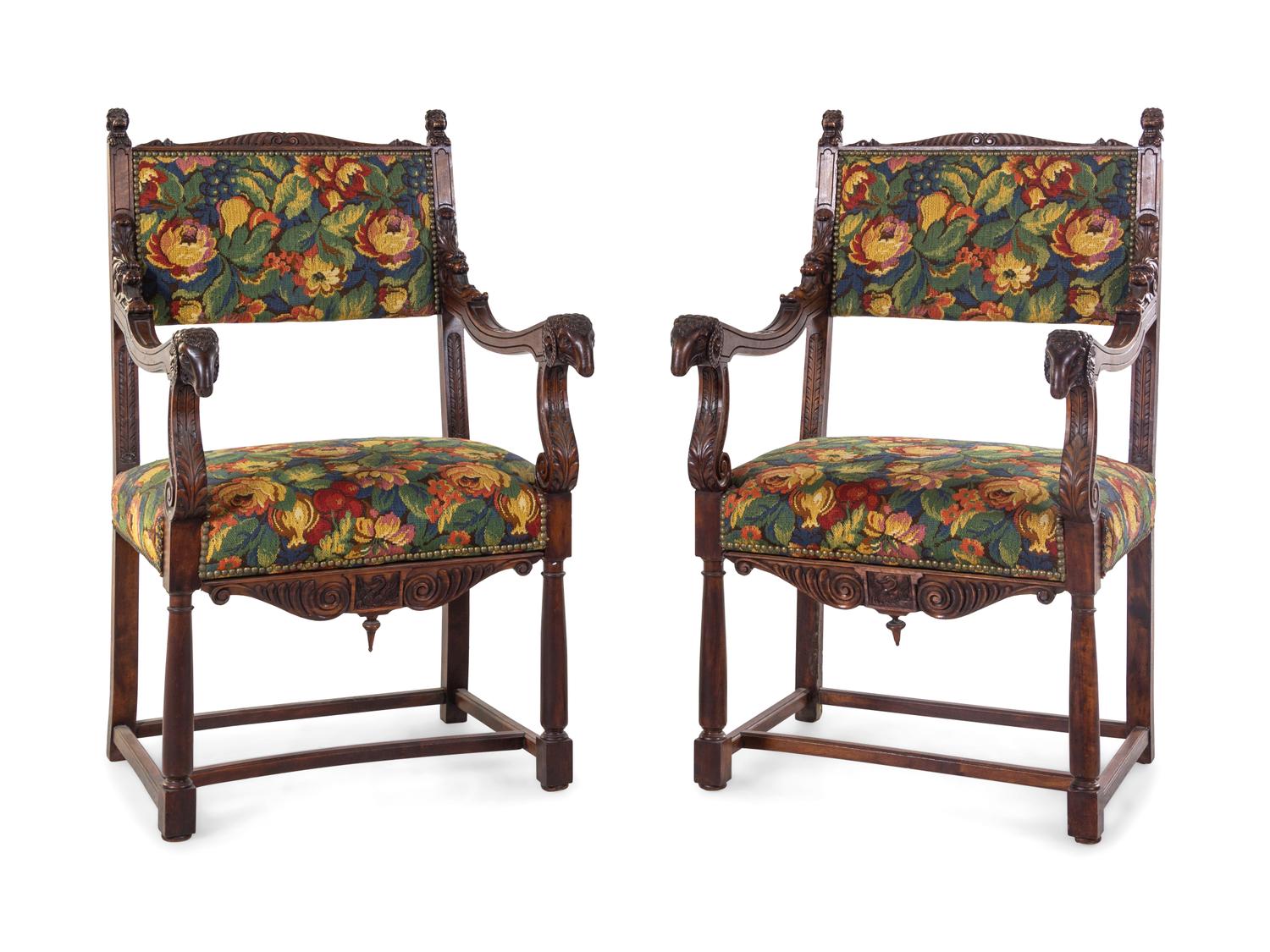 A Pair of Empire Style Carved Walnut Fauteuils