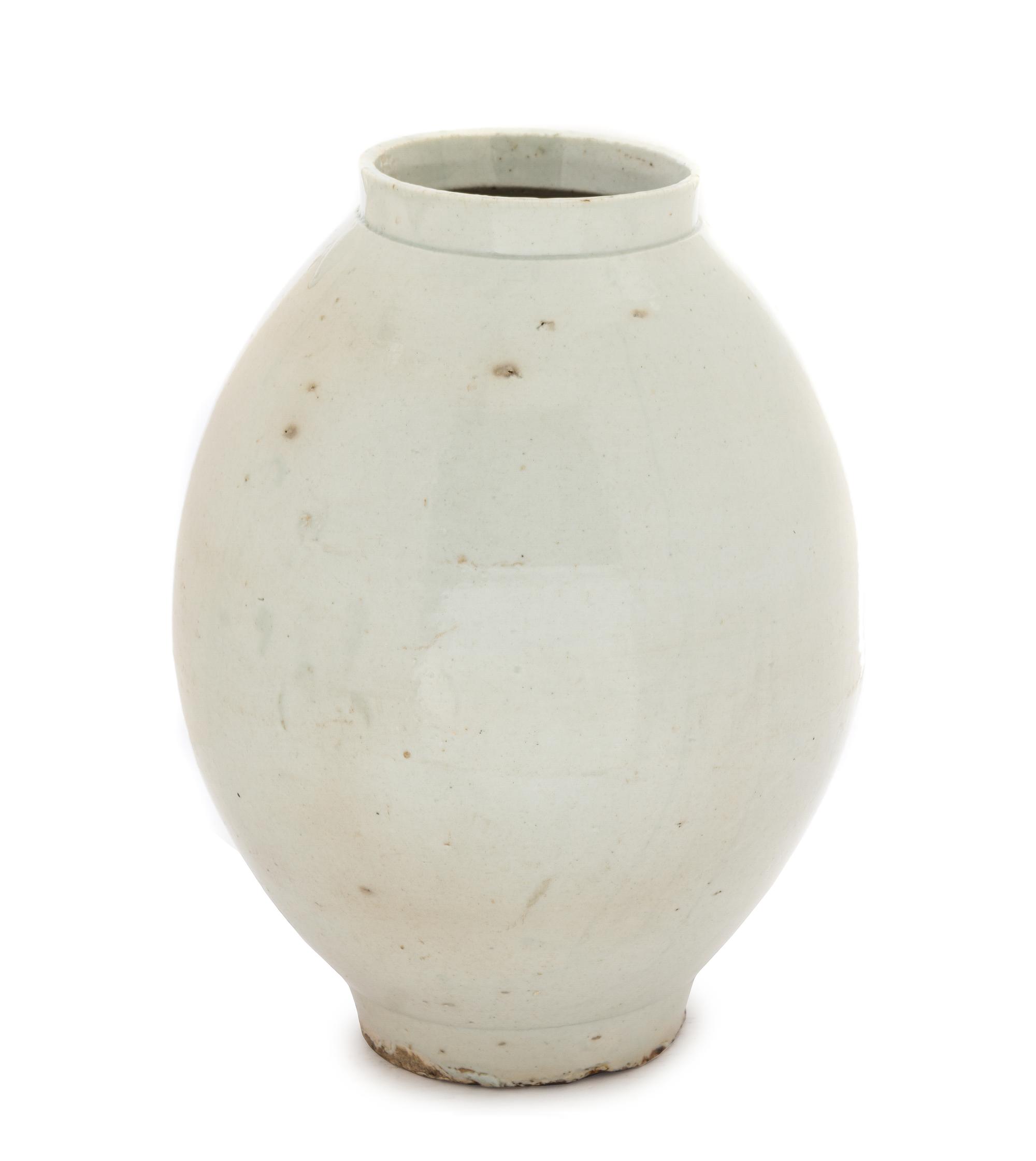 A Korean White Glazed Porcelain Storage Jar JOSEON DYNASTY, 18TH/19TH CENTURY Height 14 1/4 inches. — JOSEON DYNASTY, 18TH/19TH CENTURY