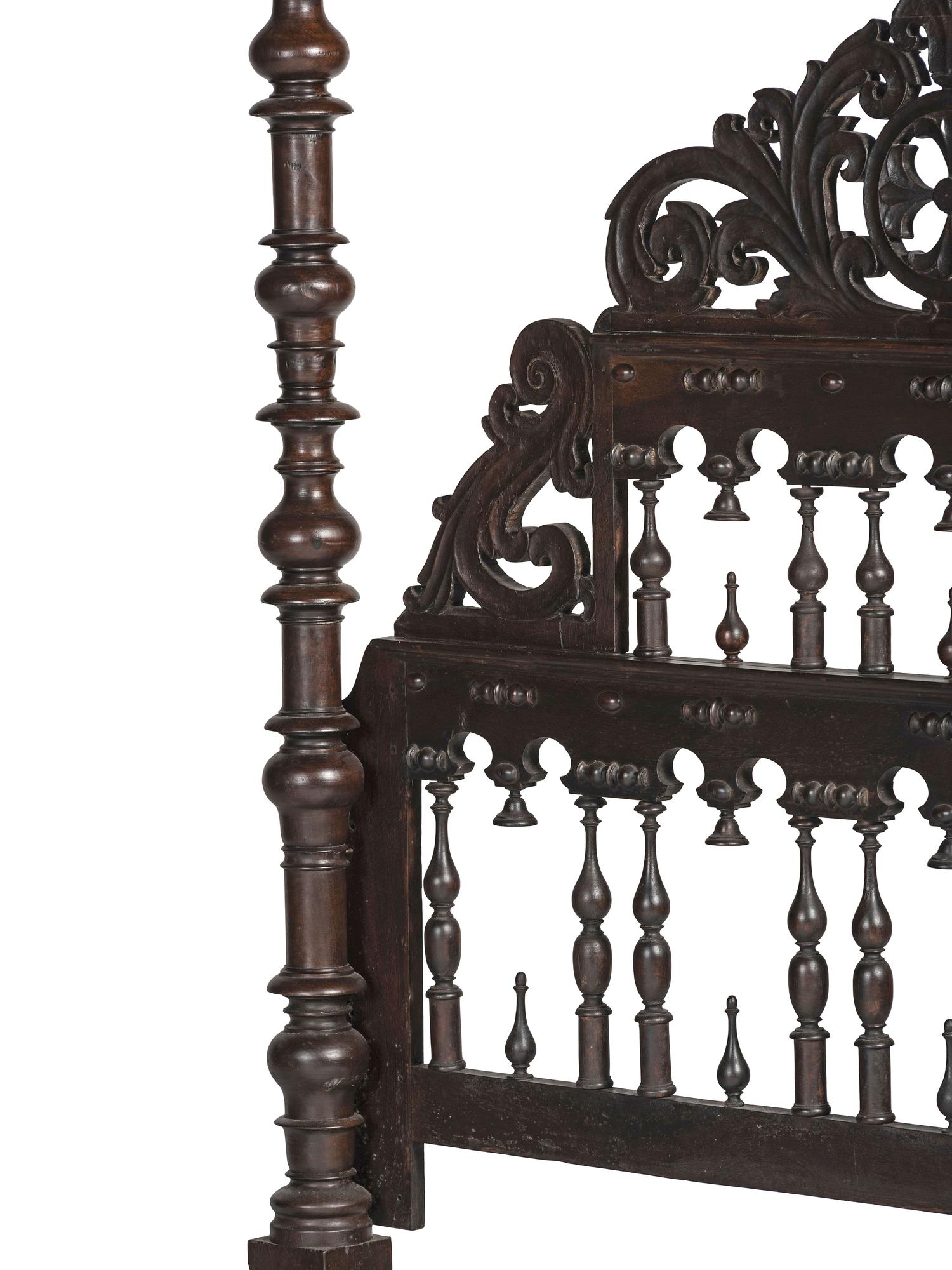 A Gothic Revival Walnut Four Poster Bed