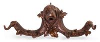 A Black Forest Carved Fruitwood Wall Rack, Width 23 inches.