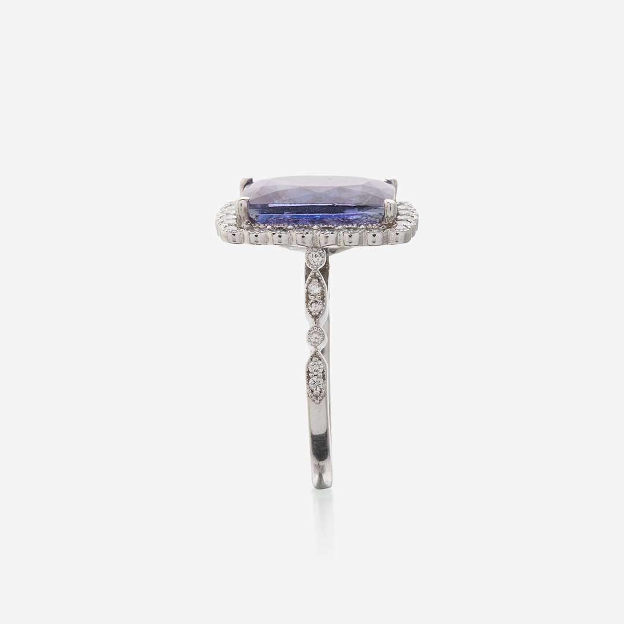 A tanzanite, diamond, and eighteen karat white gold ring
