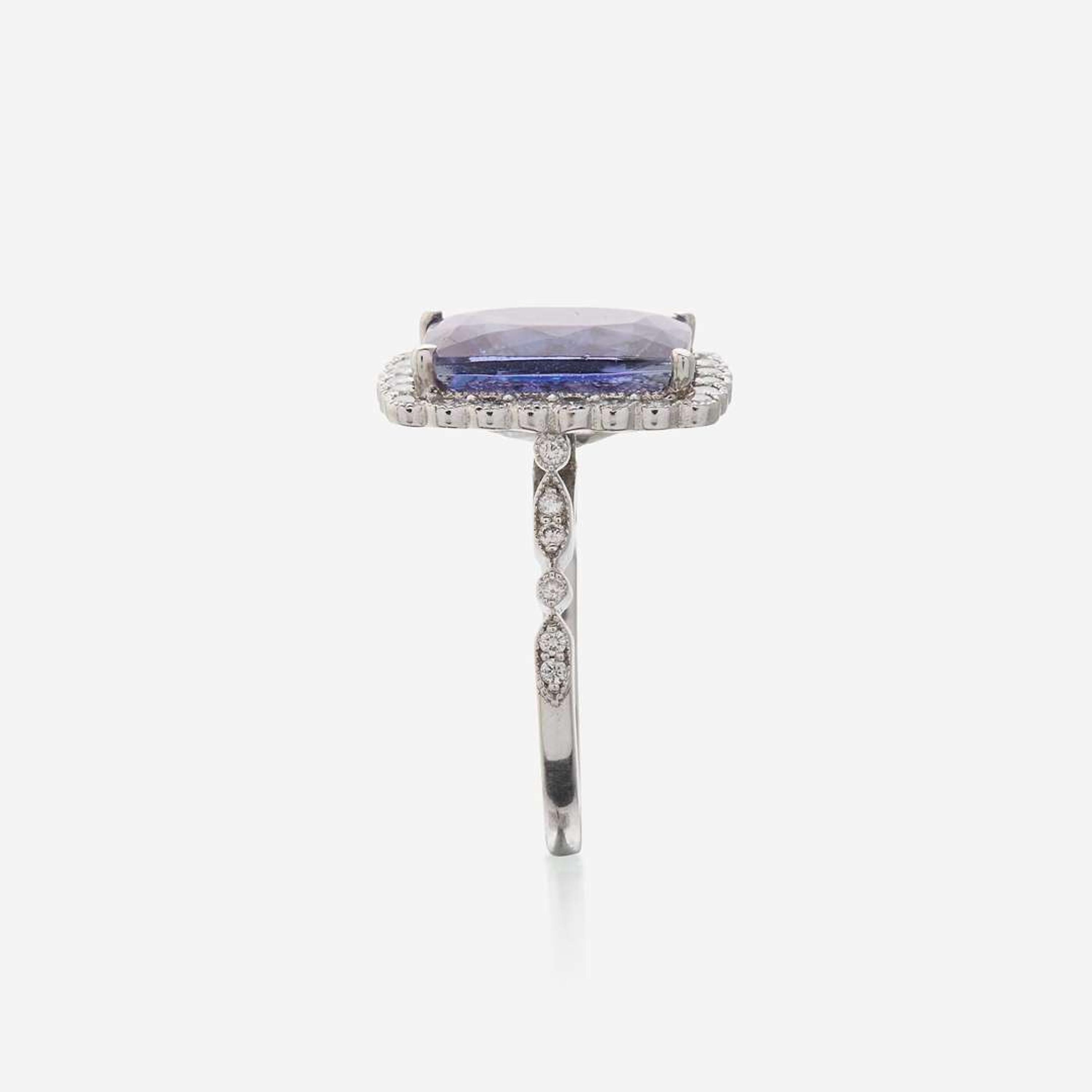 A tanzanite, diamond, and eighteen karat white gold ring