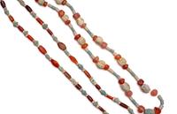 Two Near Eastern Carnelian and Faience Bead Necklaces