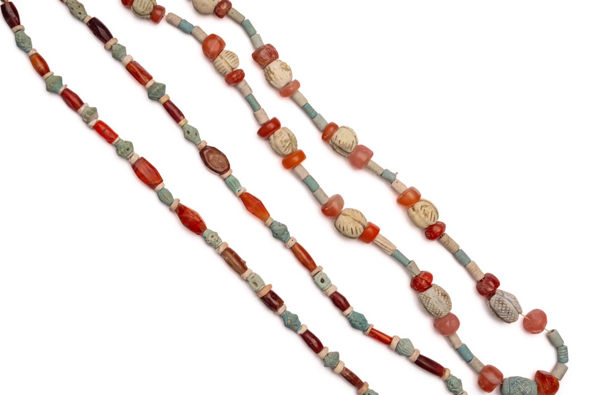 Two Near Eastern Carnelian and Faience Bead Necklaces