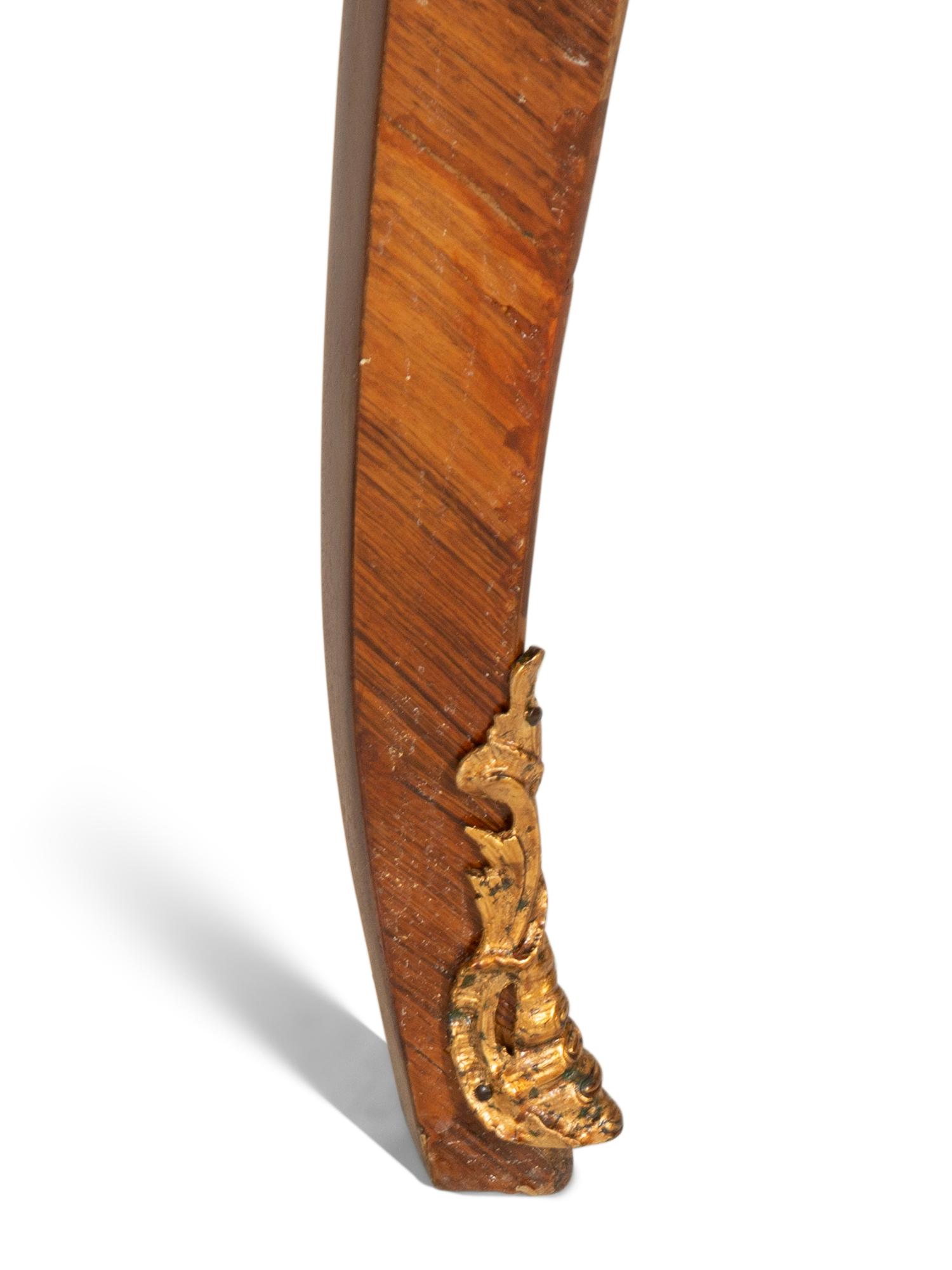 A Louis XV Style Gilt Bronze Mounted Tulipwood and Marquetry Extension Dining Table