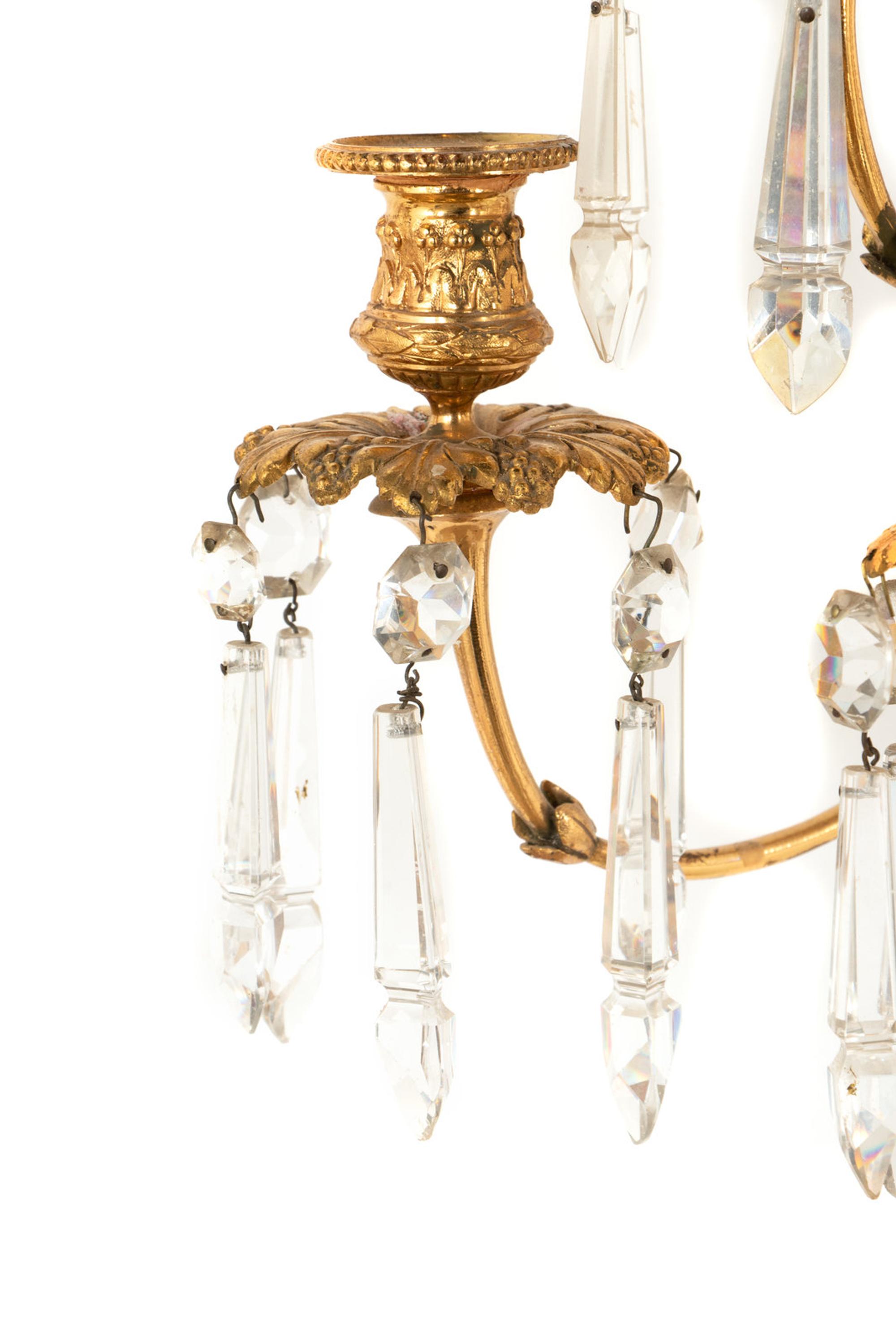 A Pair of Louis XVI Style Gilt Bronze and Cut Glass Nine-Light Sconces