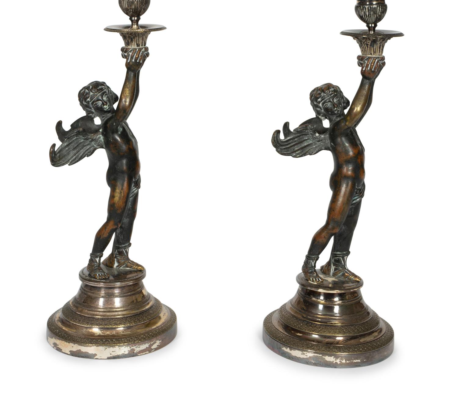 A Pair of Continental Patinated Bronze and Silver-Plate Candlesticks