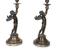 A Pair of Continental Patinated Bronze and Silver-Plate Candlesticks
