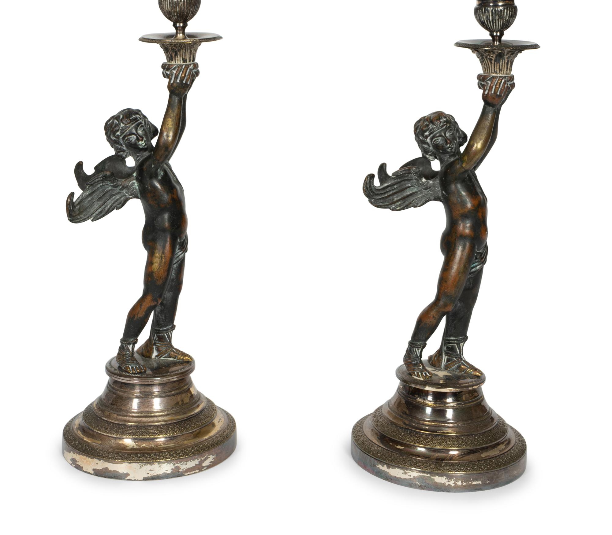 A Pair of Continental Patinated Bronze and Silver-Plate Candlesticks