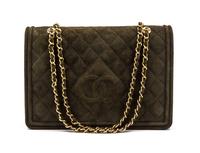 A Chanel Green Quilted Suede Flap Bag, 11 x 7 1/2 x 3 inches.