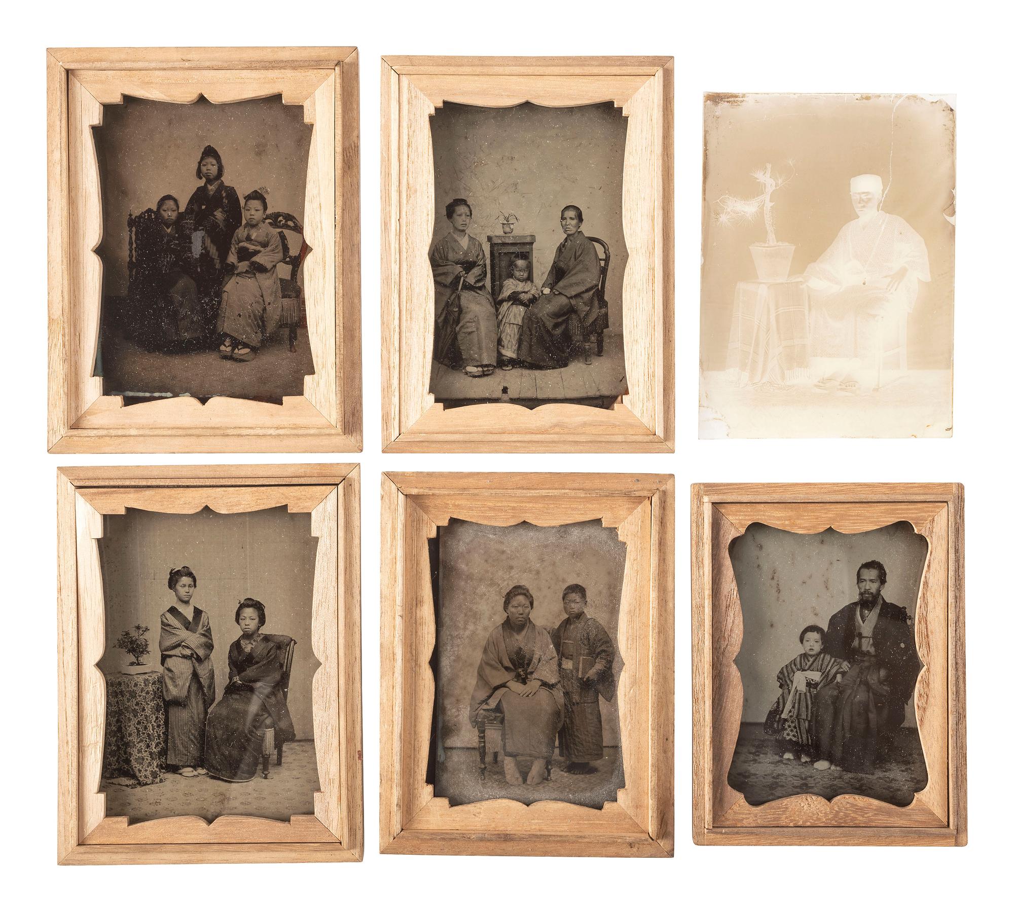 [EARLY PHOTOGRAPHY]. A group of 12 Japanese ambrotypes, most housed in traditional kiri wood boxes, including: