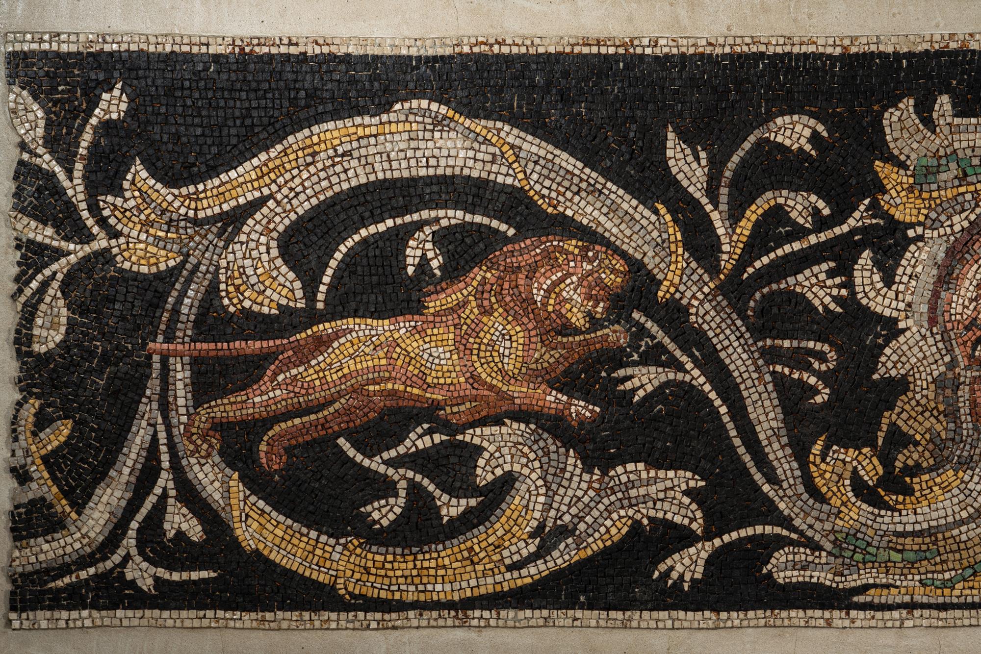 A Roman-Style Polychrome Mosaic Panel with a Bearded Head and Two Animals