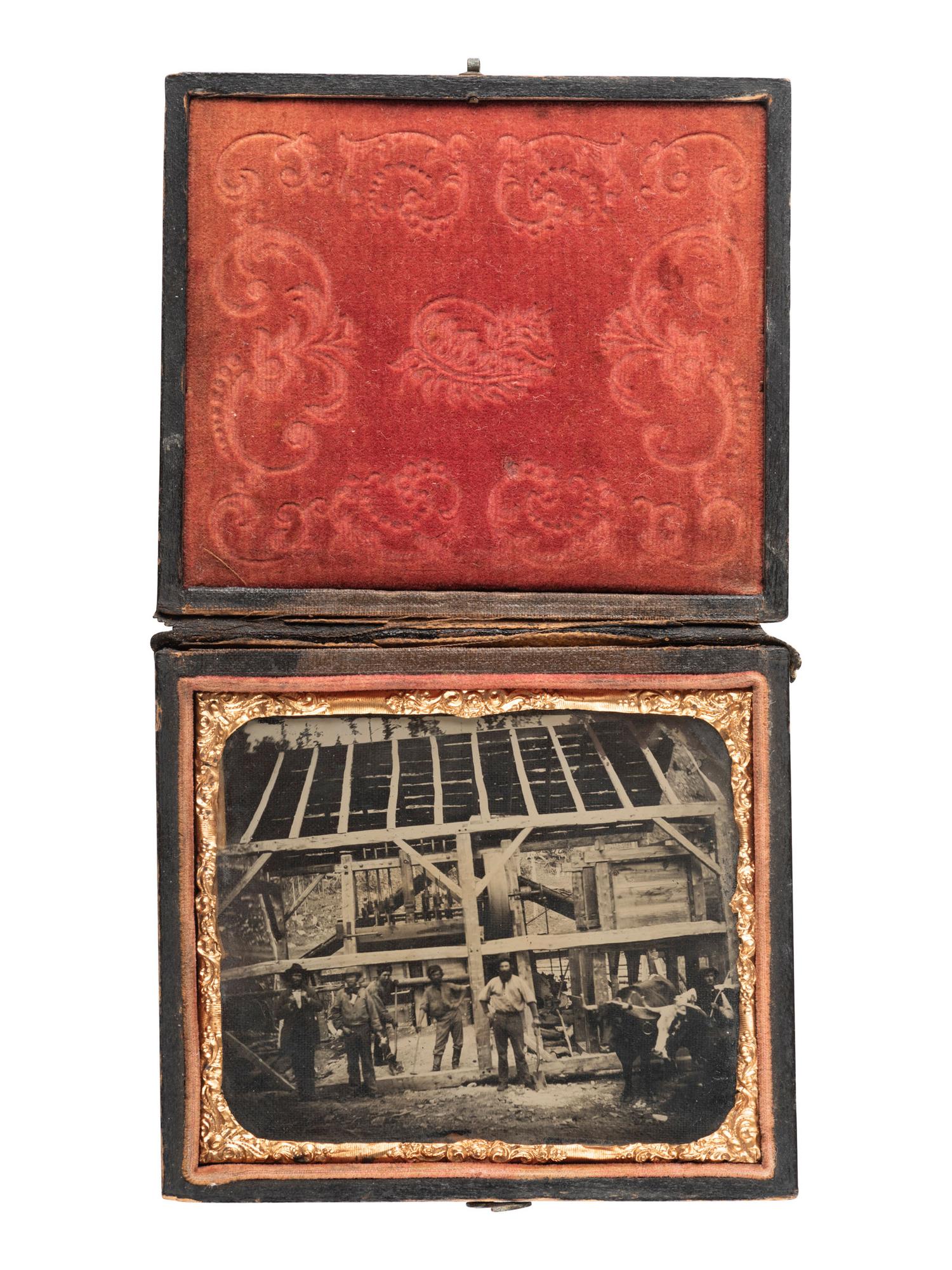 [CALIFORNIA] -- [GOLD RUSH]. Sixth plate ambrotype of stamping mill for mines showing 5 miners and oxen outside the as yet uncovered mill. [California], [ca 1850s].