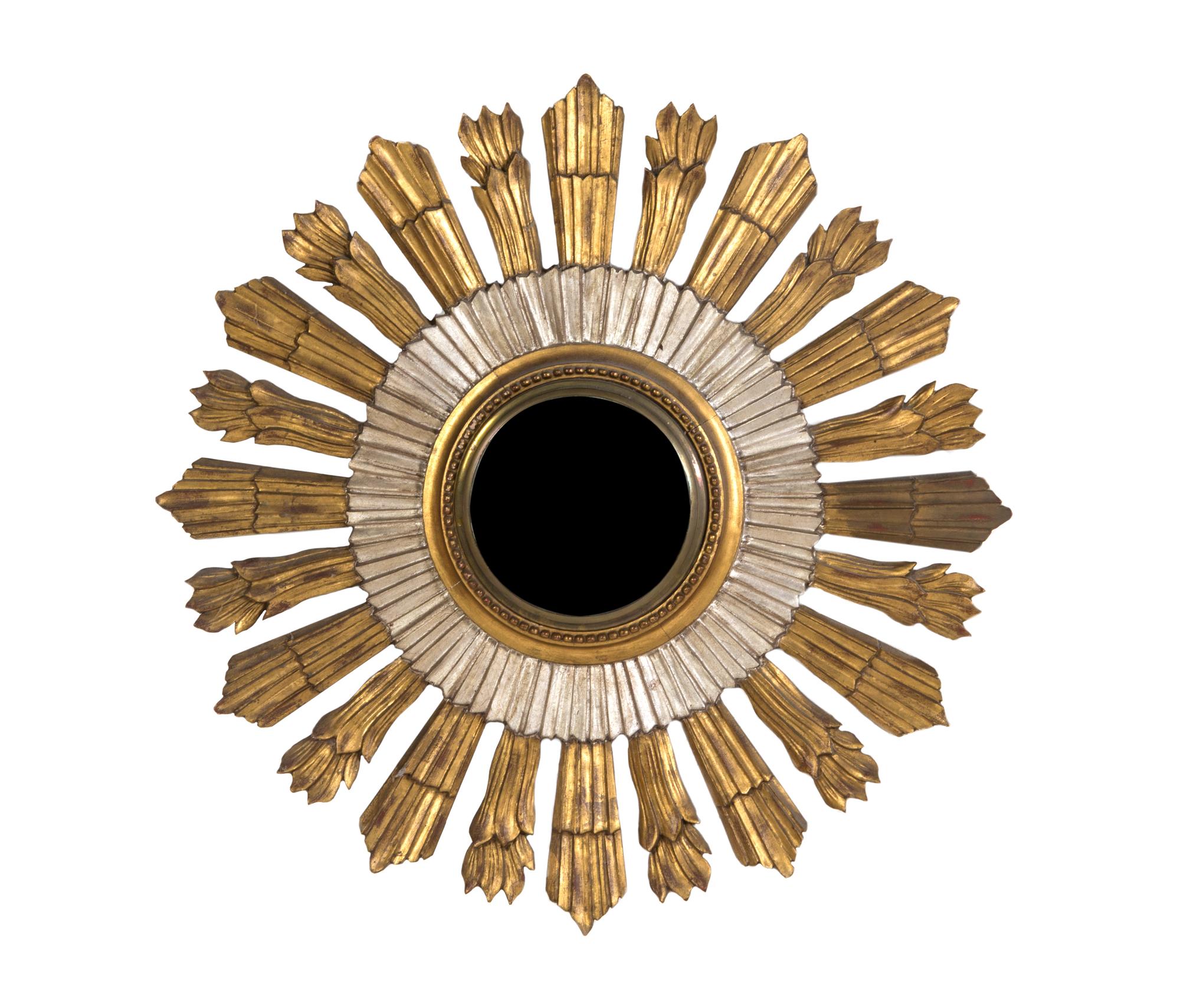 A Gilt and Silvered Wood Sunburst Mirror, Diameter 29 3/4 inches.