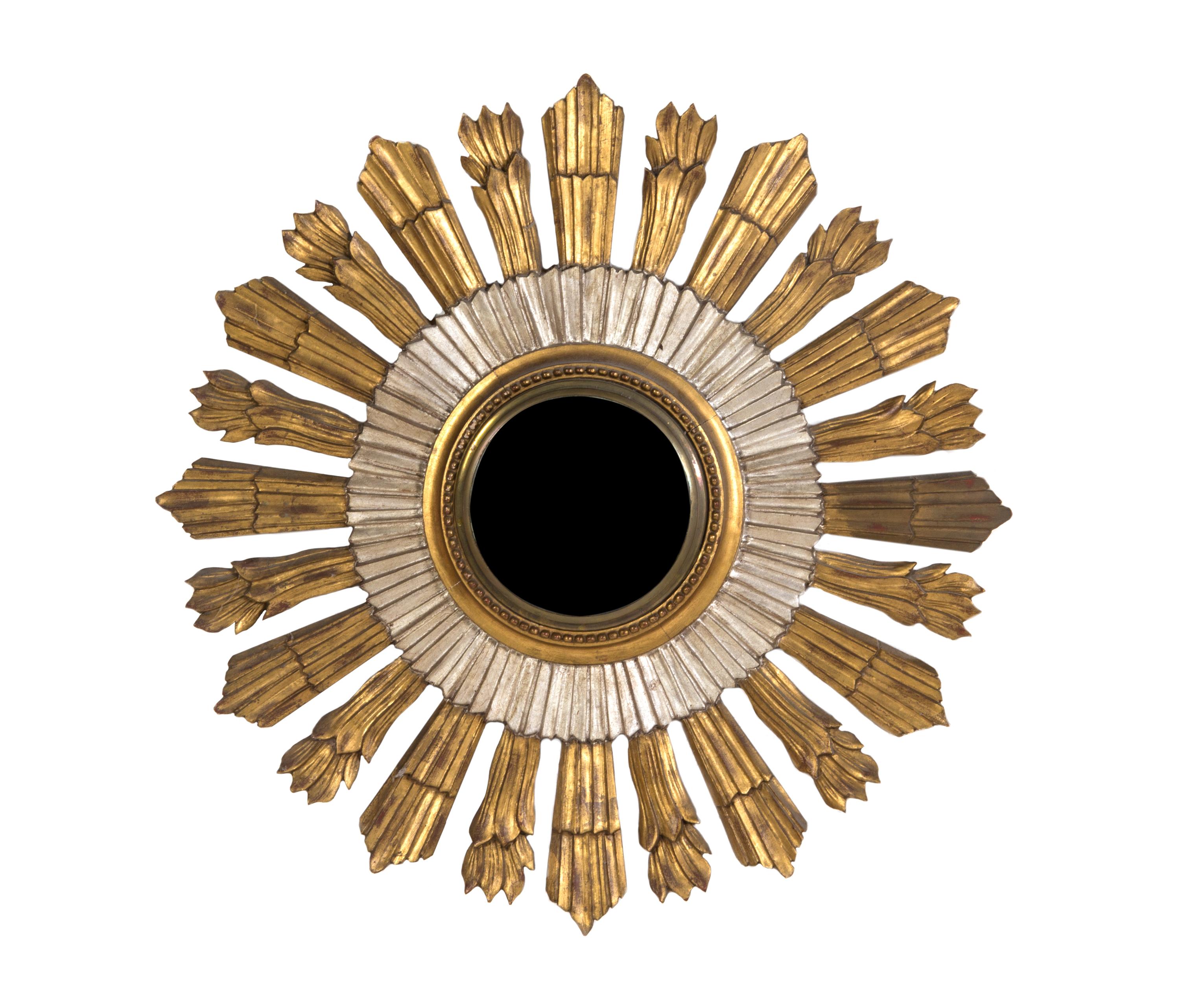 A Gilt and Silvered Wood Sunburst Mirror, Diameter 29 3/4 inches.