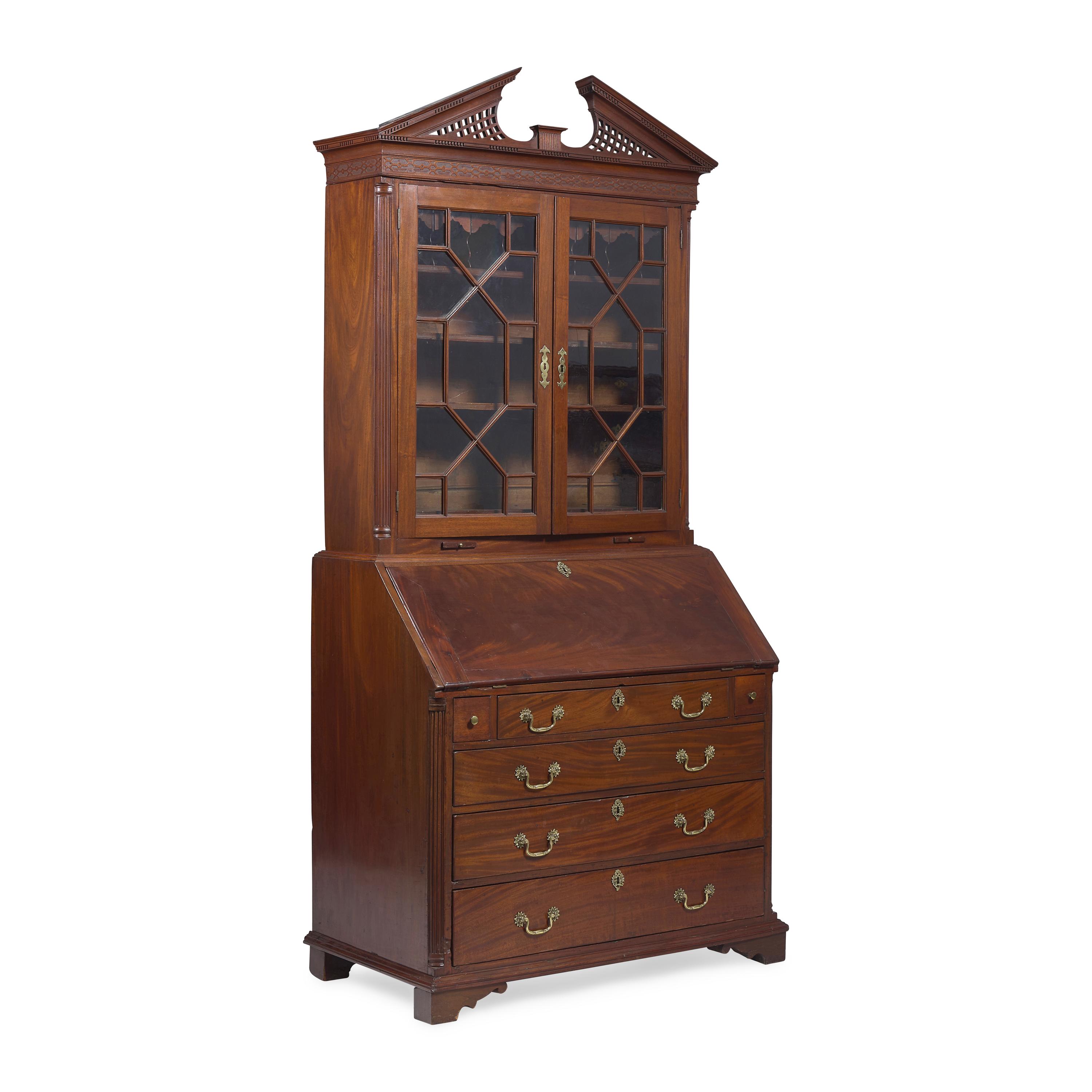 A Chippendale Carved Mahogany Desk-and-Bookcase