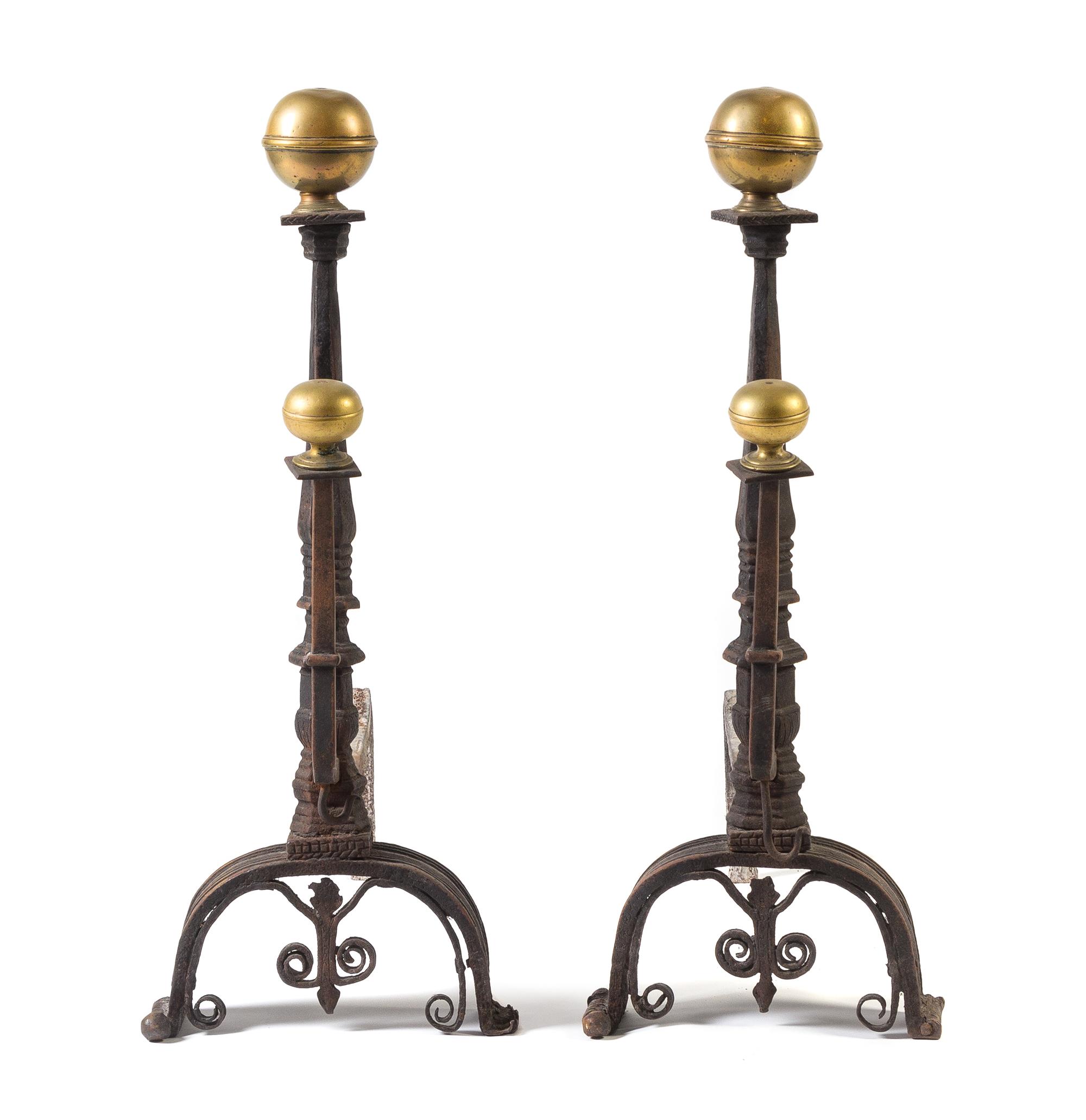 A Pair of Italian Baroque Brass and Iron Andirons Height 30 inches. — LATE 15TH CENTURY