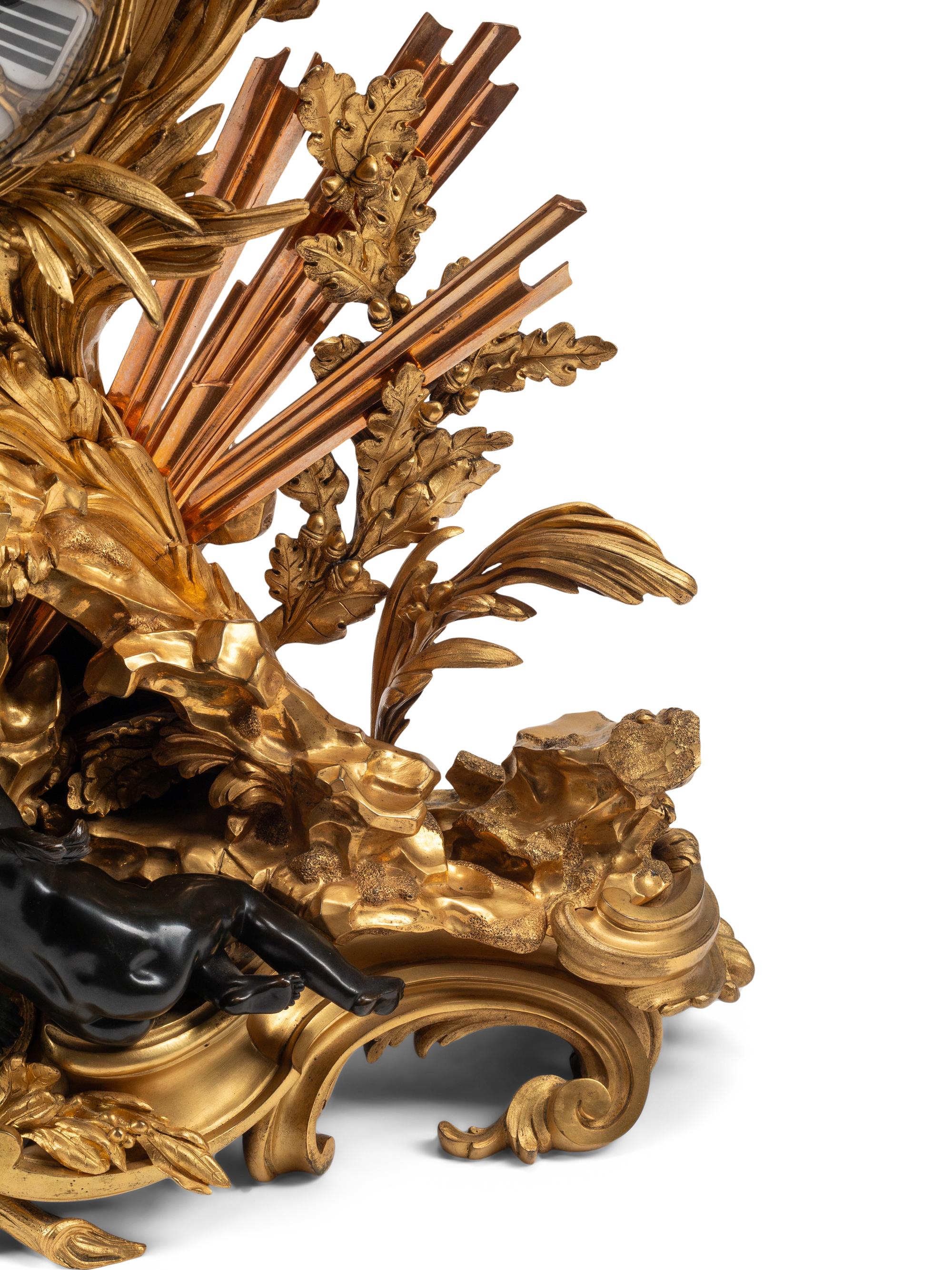 A French Gilt and Patinated Bronze Pendule à la Gloire du Roi
