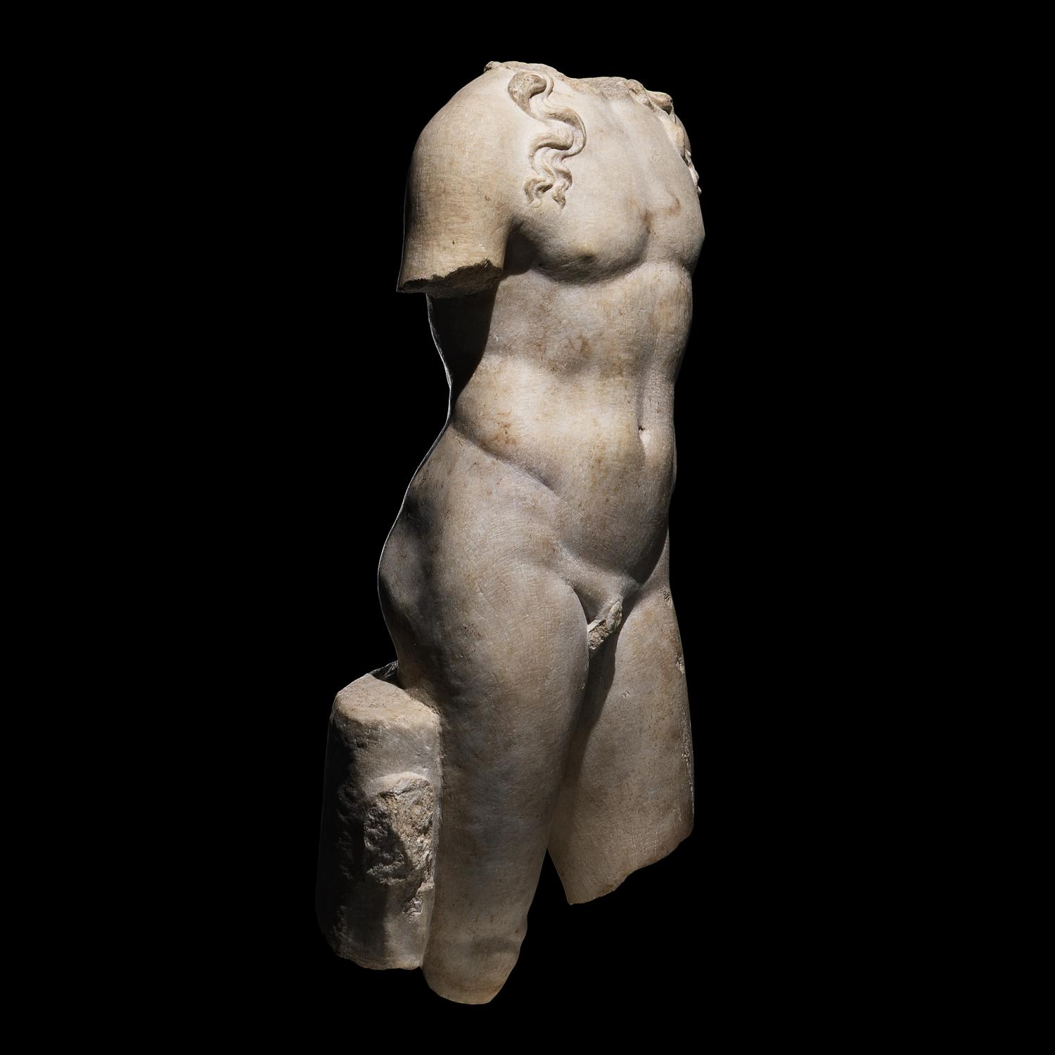 A Roman Marble Torso of a Youthful God