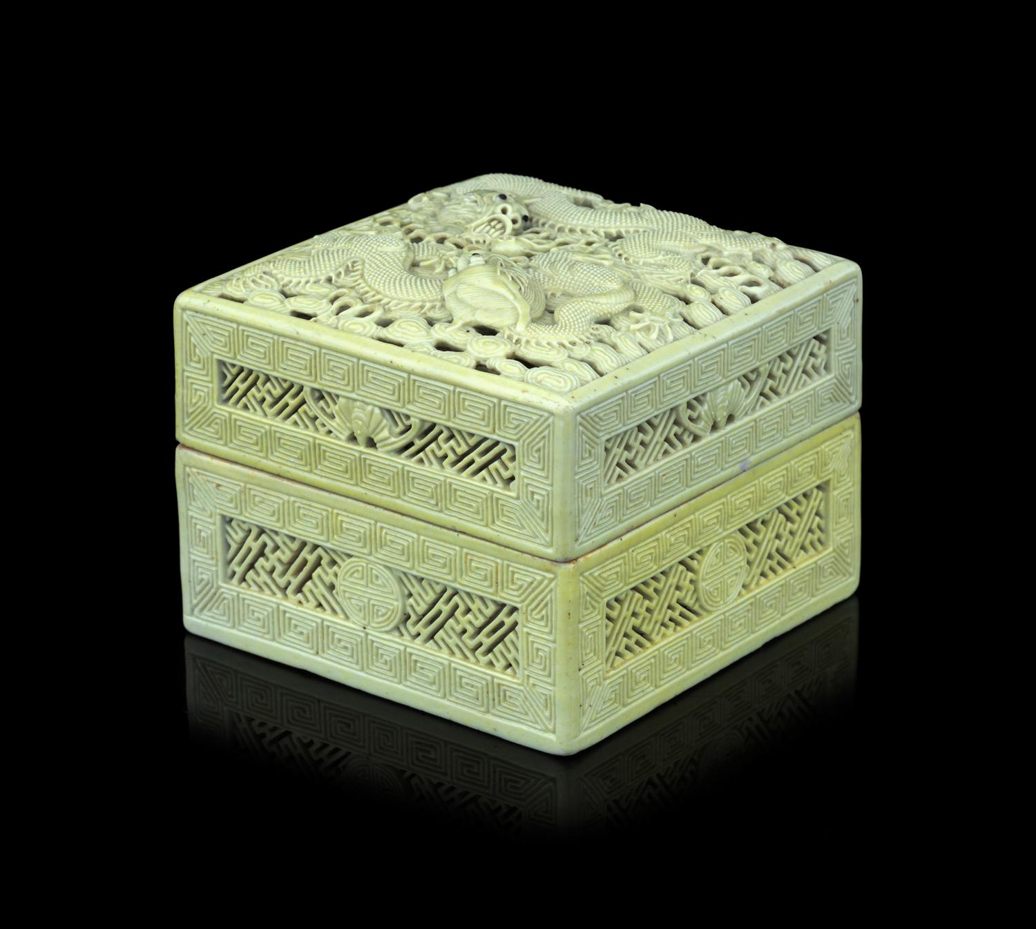 A Carved and Molded Pale Lime Glazed Porcelain 'Dragons' Seal Paste Box and Cover