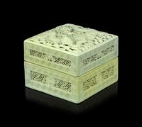 A Carved and Molded Pale Lime Glazed Porcelain 'Dragons' Seal Paste Box and Cover