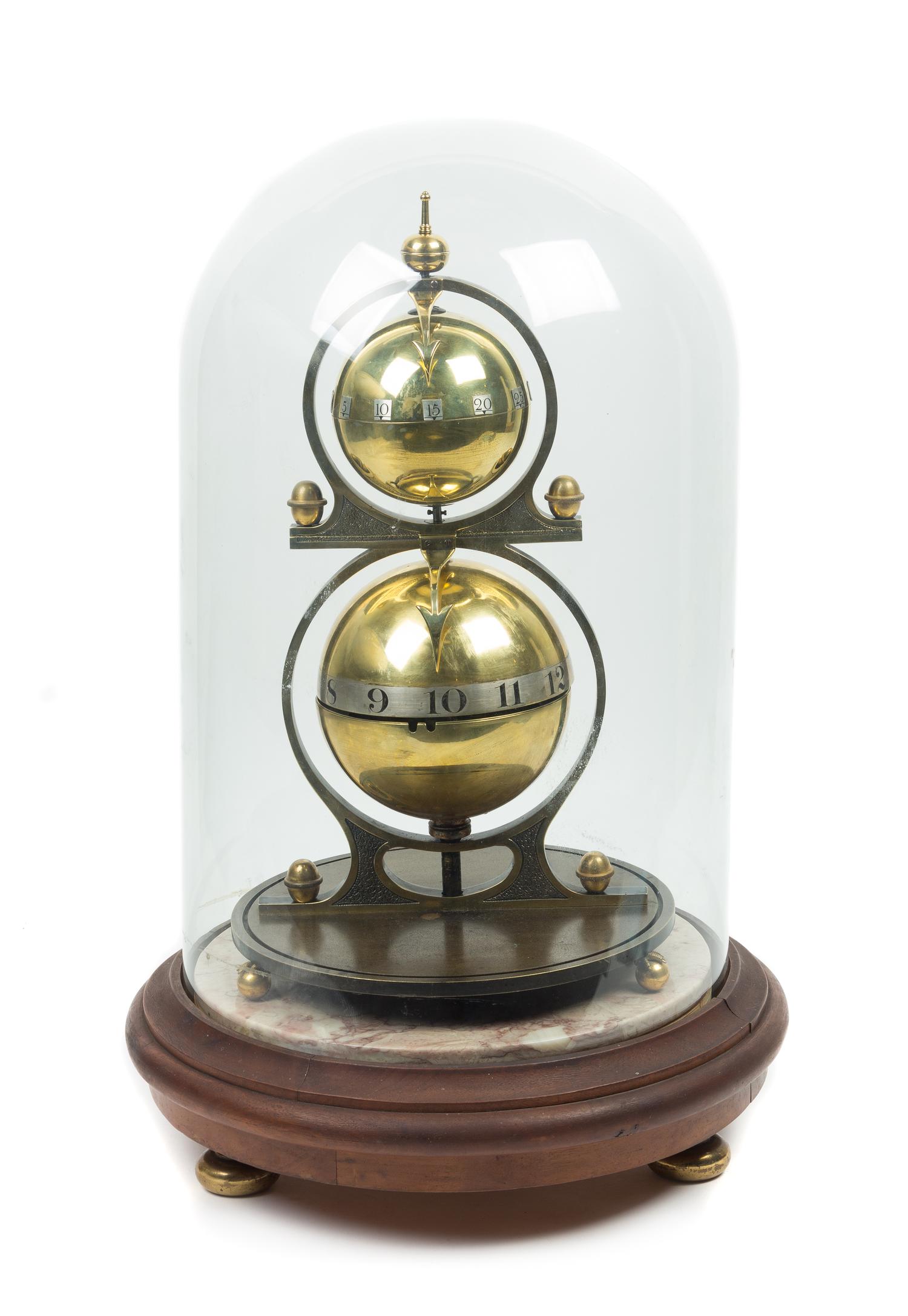 A Gustave Jeager Double Globe Patent Clock Height overall 17 1/2 inches. — 19TH/20TH CENTURY