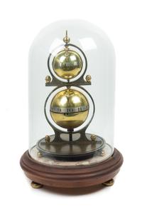 A Gustave Jeager Double Globe Patent Clock Height overall 17 1/2 inches. — 19TH/20TH CENTURY