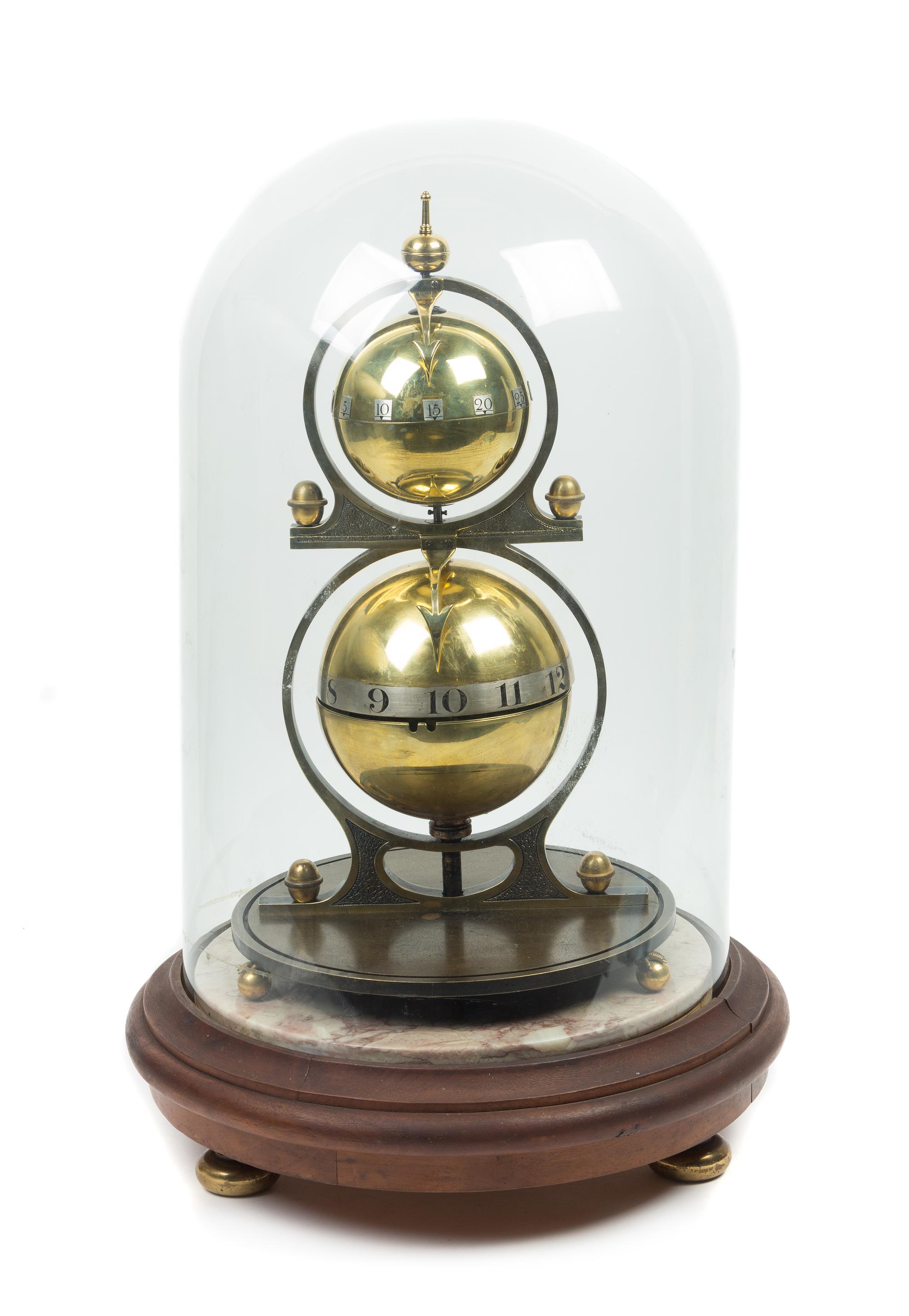 A Gustave Jeager Double Globe Patent Clock Height overall 17 1/2 inches. — 19TH/20TH CENTURY