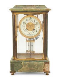 A French Parcel Gilt Bronze and Onyx Clock