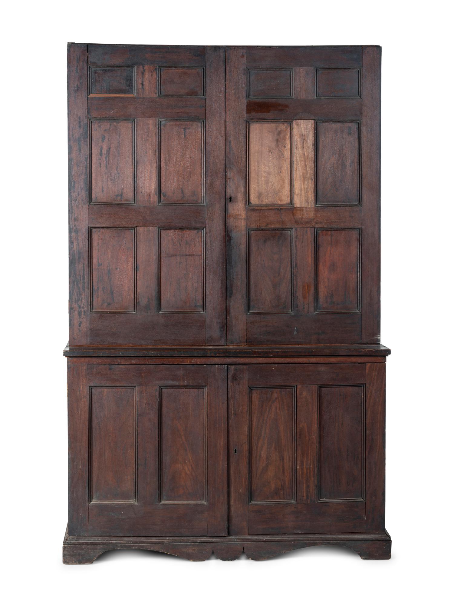 A Chippendale Style Walnut Paneled Step Back Cupboard