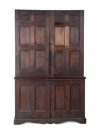 A Chippendale Style Walnut Paneled Step Back Cupboard