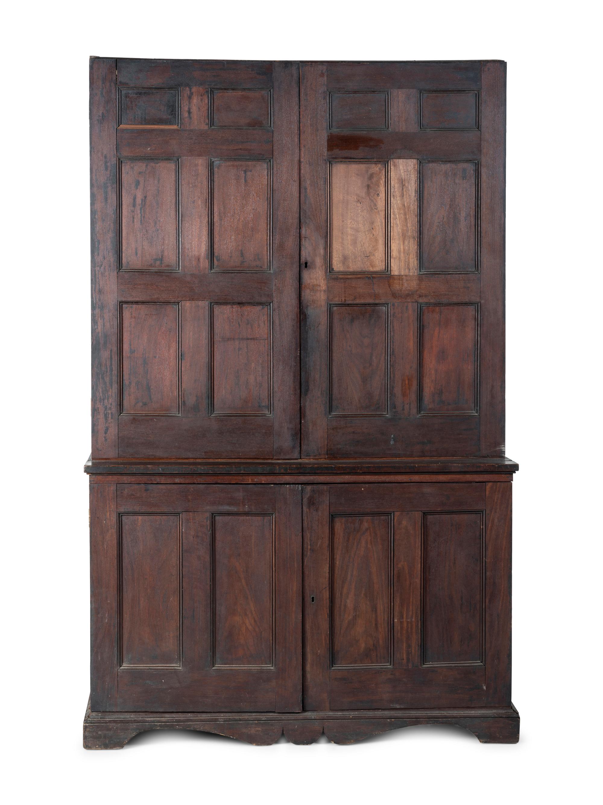 A Chippendale Style Walnut Paneled Step Back Cupboard
