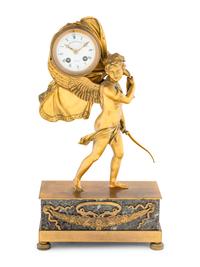 An Empire Style Gilt Bronze and Marble Figural Clock