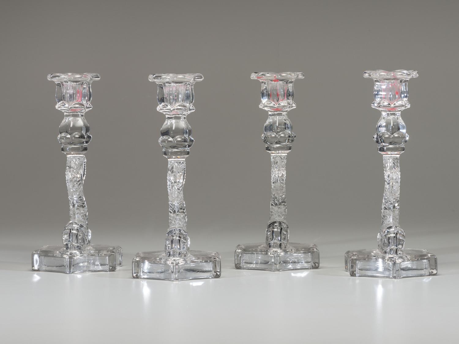 Four Molded Glass Dolphin Candlesticks