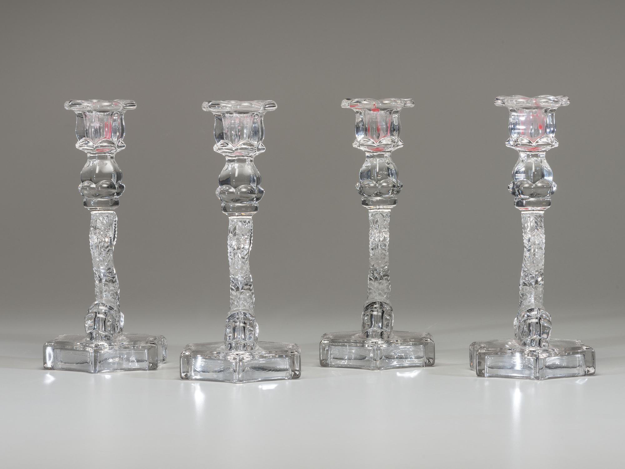 Four Molded Glass Dolphin Candlesticks