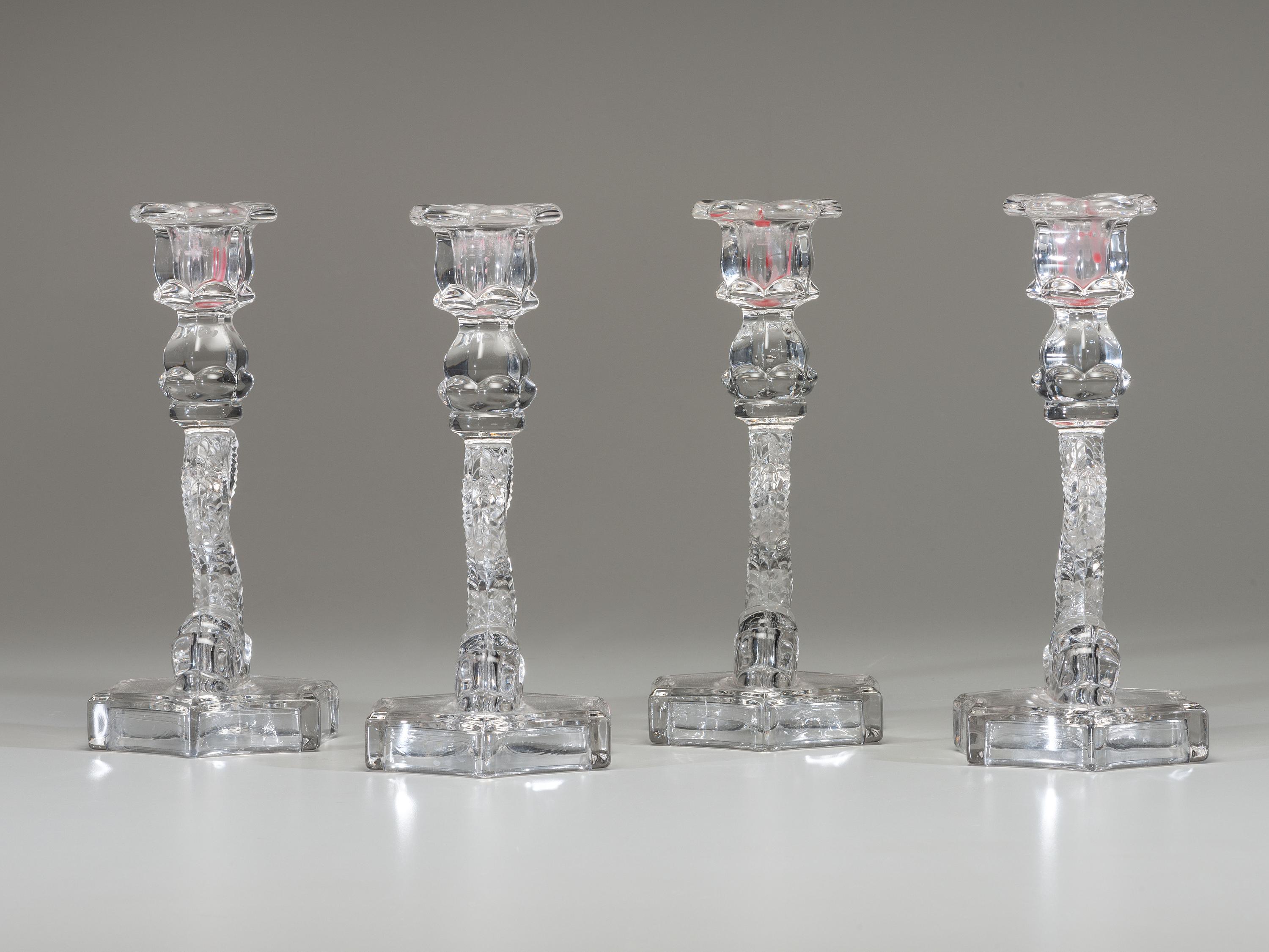 Four Molded Glass Dolphin Candlesticks