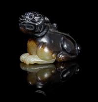 A Celadon and Brown Jade Carving of a Bixie Length 2 inches.