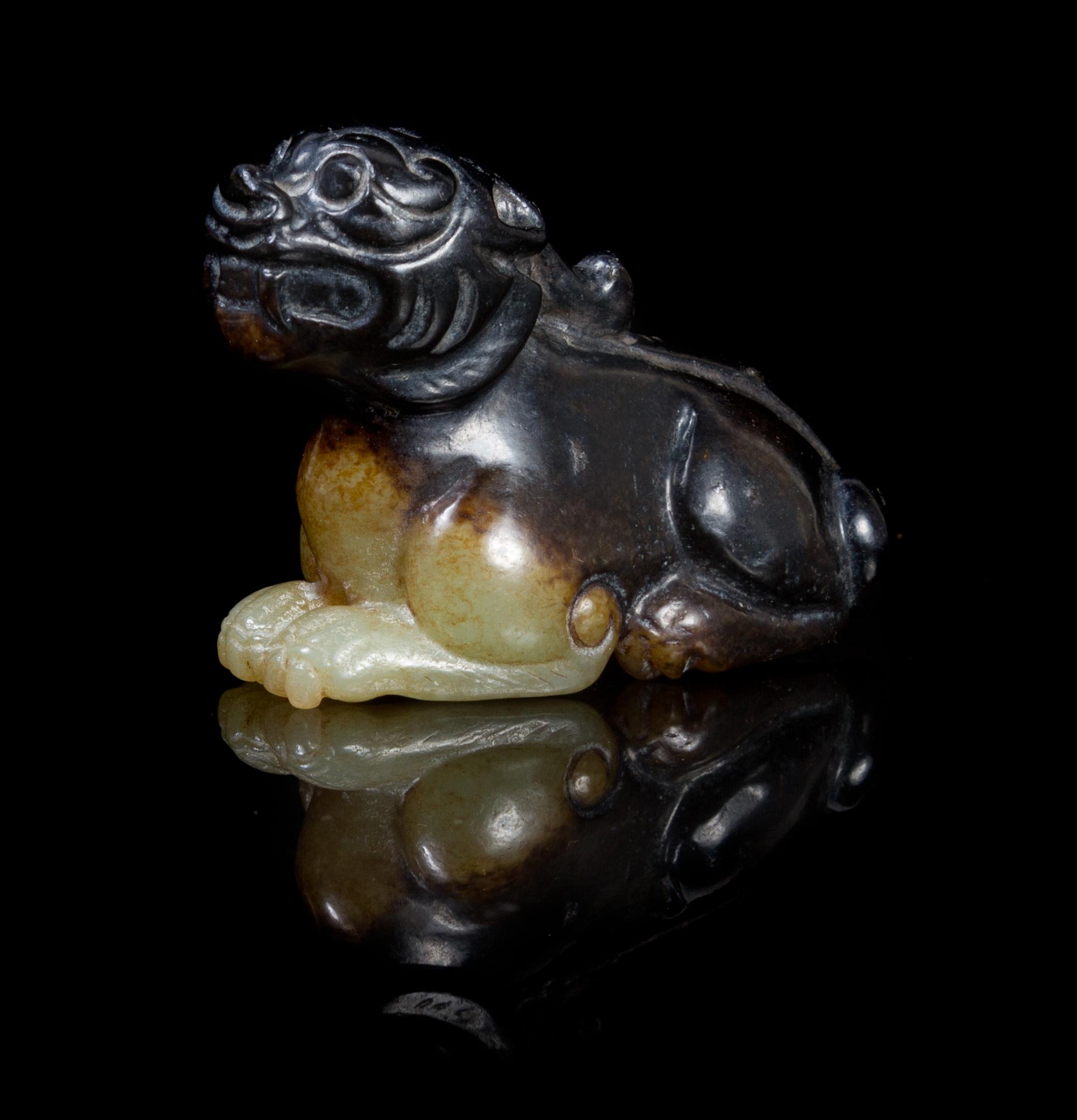 A Celadon and Brown Jade Carving of a Bixie Length 2 inches.