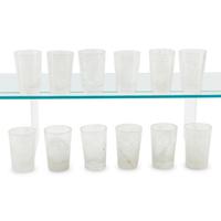 A Set of Twelve Carved Rock Crystal Tumblers