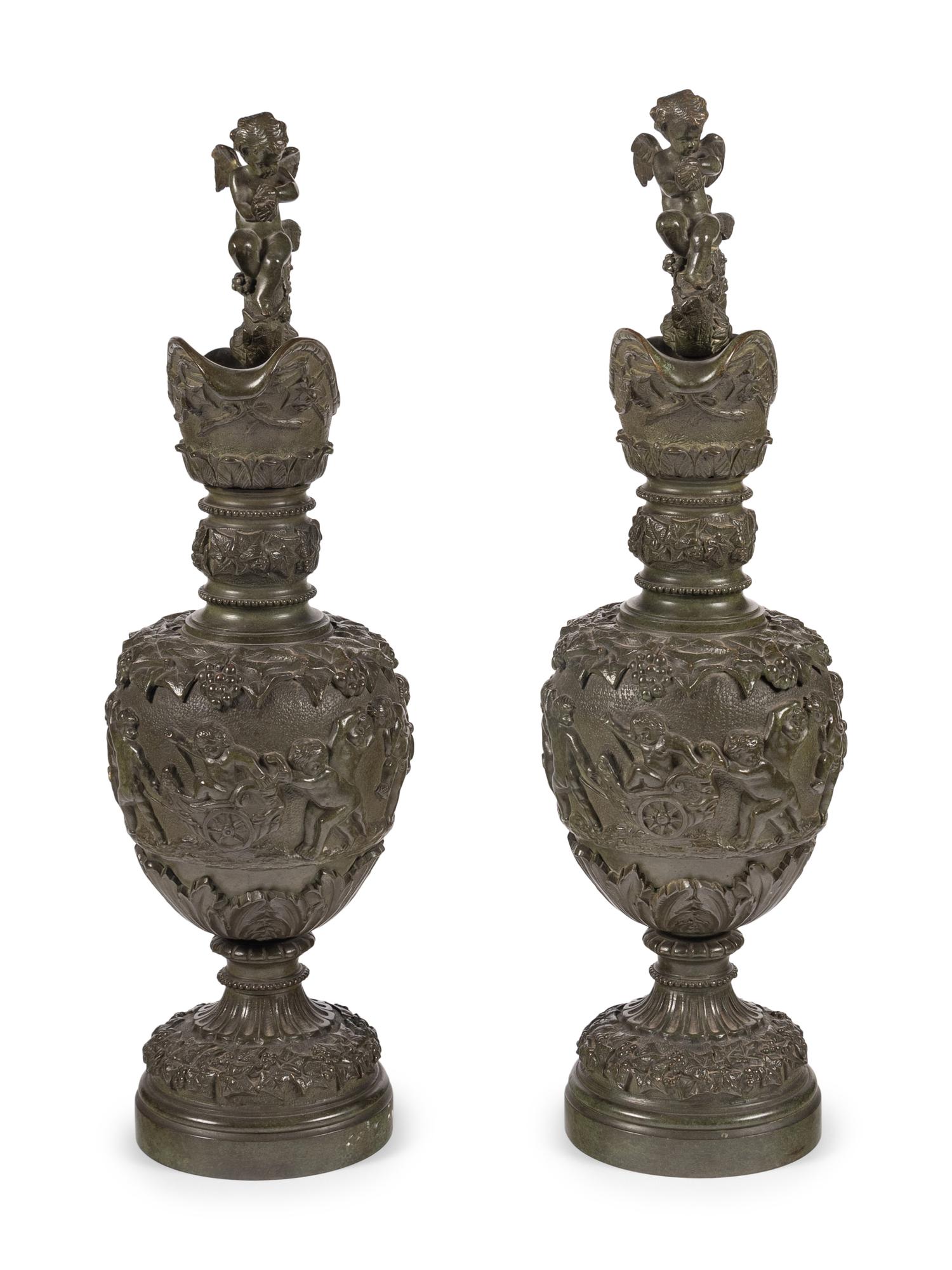 A Pair of Neoclassical Patinated Bronze Ewers with Bacchic Putti