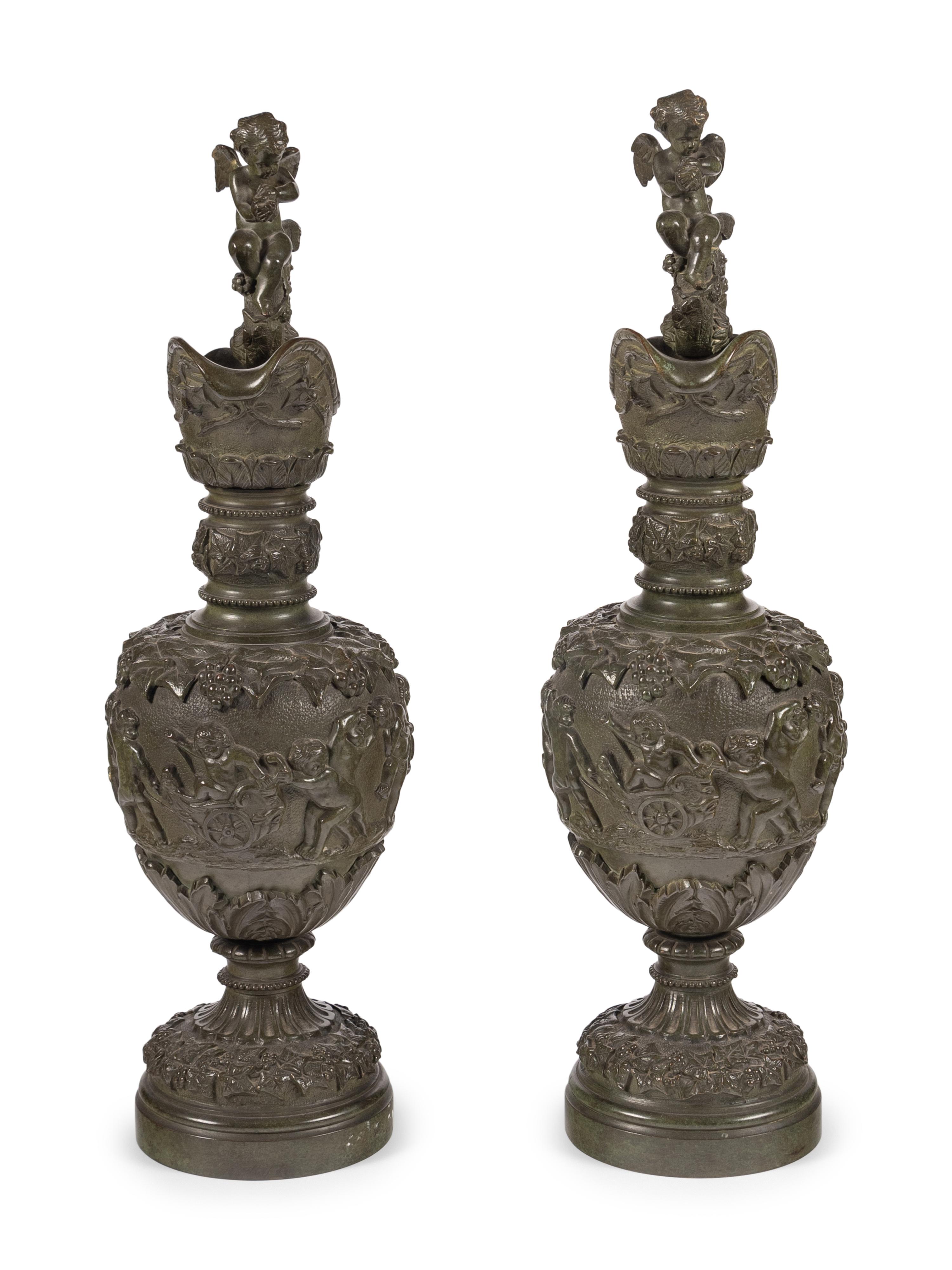 A Pair of Neoclassical Patinated Bronze Ewers with Bacchic Putti
