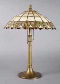 An American Leaded Glass Lamp, Height 21 inches, diameter of shade 15 1/2 inches.