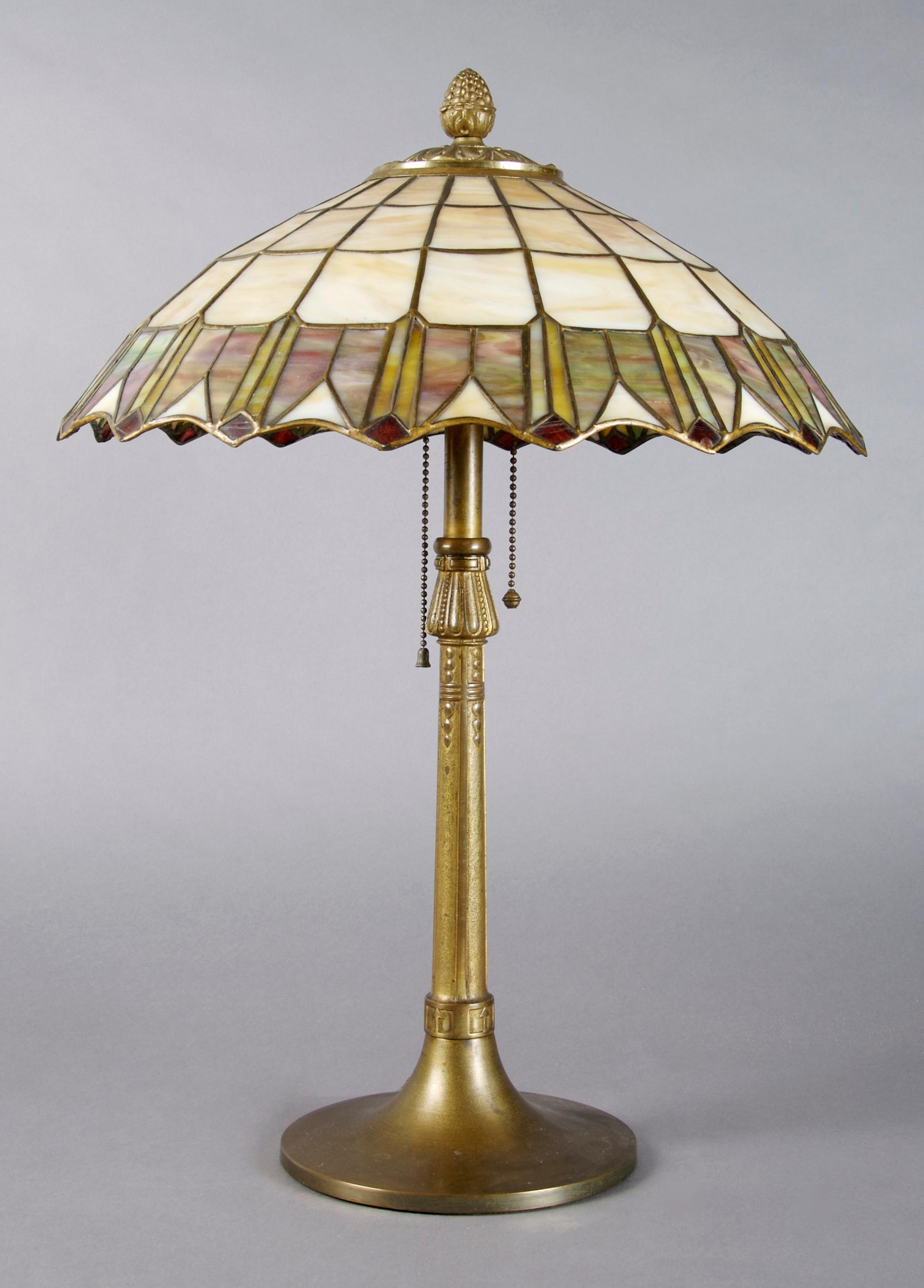 An American Leaded Glass Lamp, Height 21 inches, diameter of shade 15 1/2 inches.
