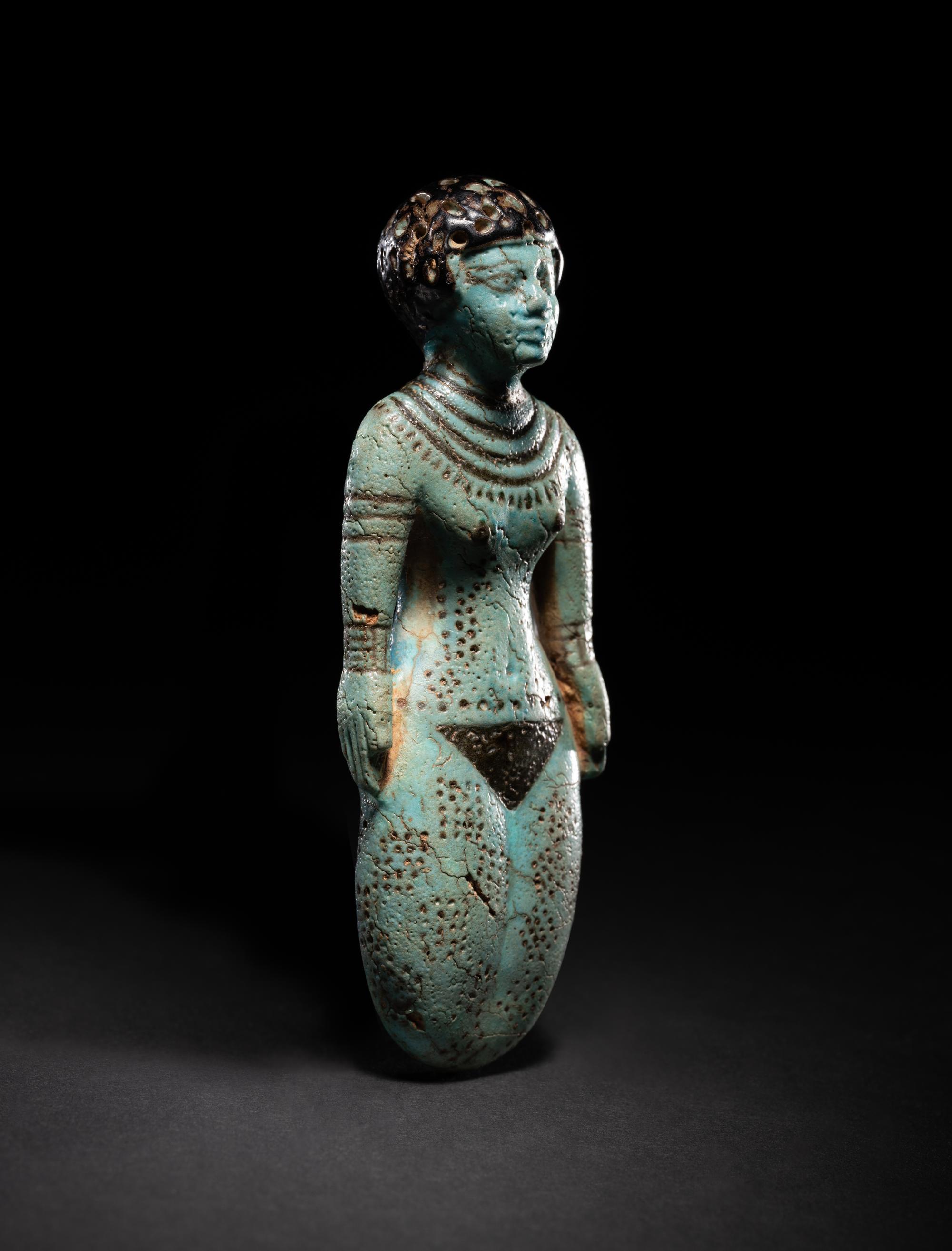 An Egyptian Faience Female Figure