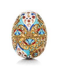 A Russian Enameled Silver Egg, 19th Century, in two parts with floral and foliate decoration.