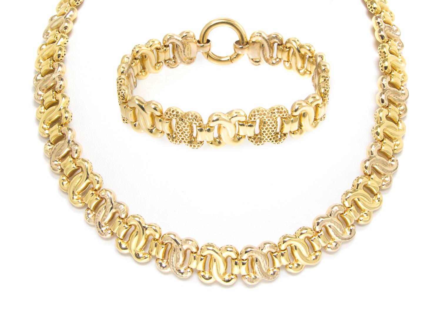 An 18 Karat Yellow Gold Fancy Link Demi Parure, 59.50 dwts.