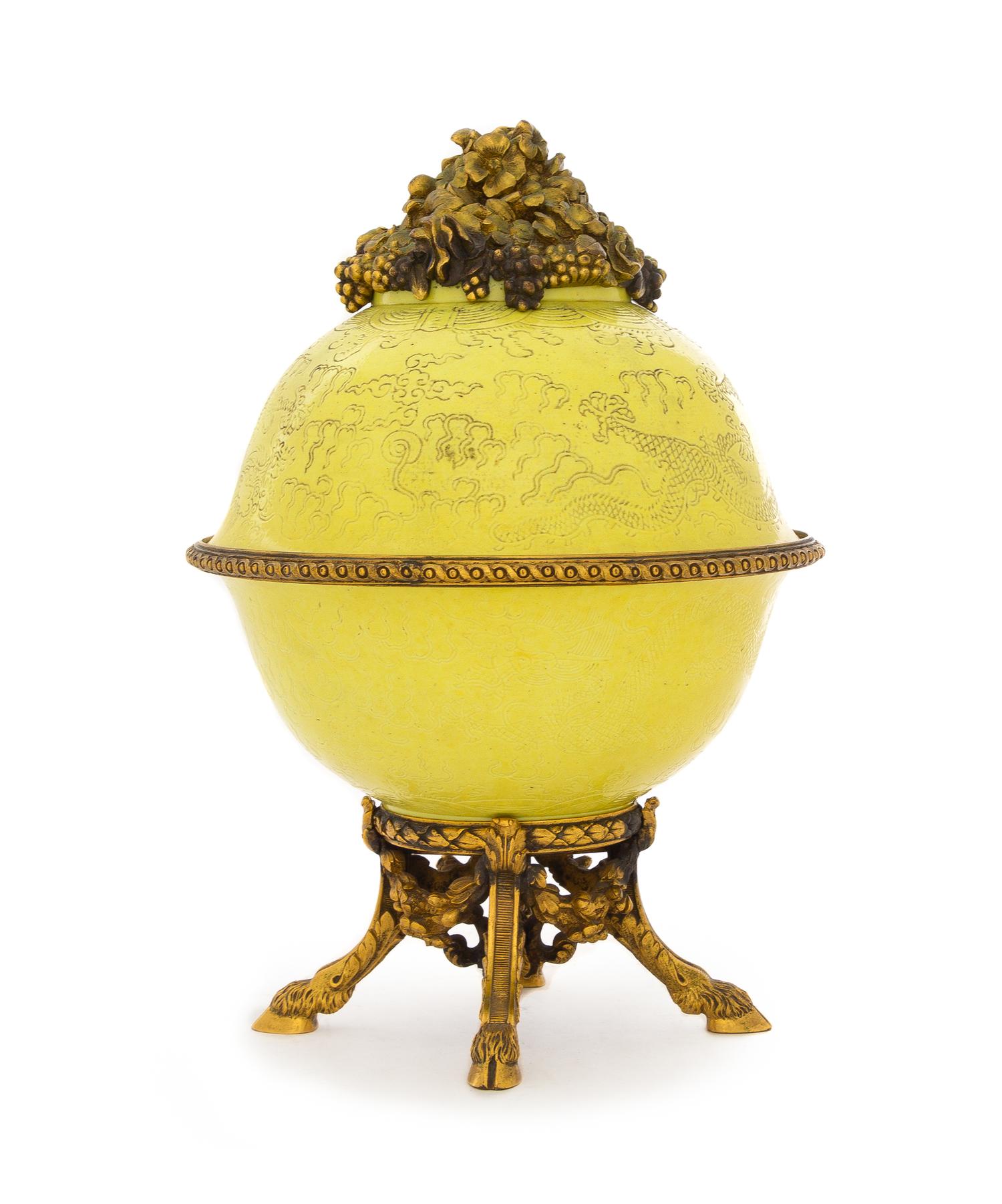 A Chinese Gilt Bronze Mounted Yellow Glazed Porcelain Covered Vessel Height overall 8 3/4 inches. — PORCELAIN: QING DYNASTY (1644-1911)