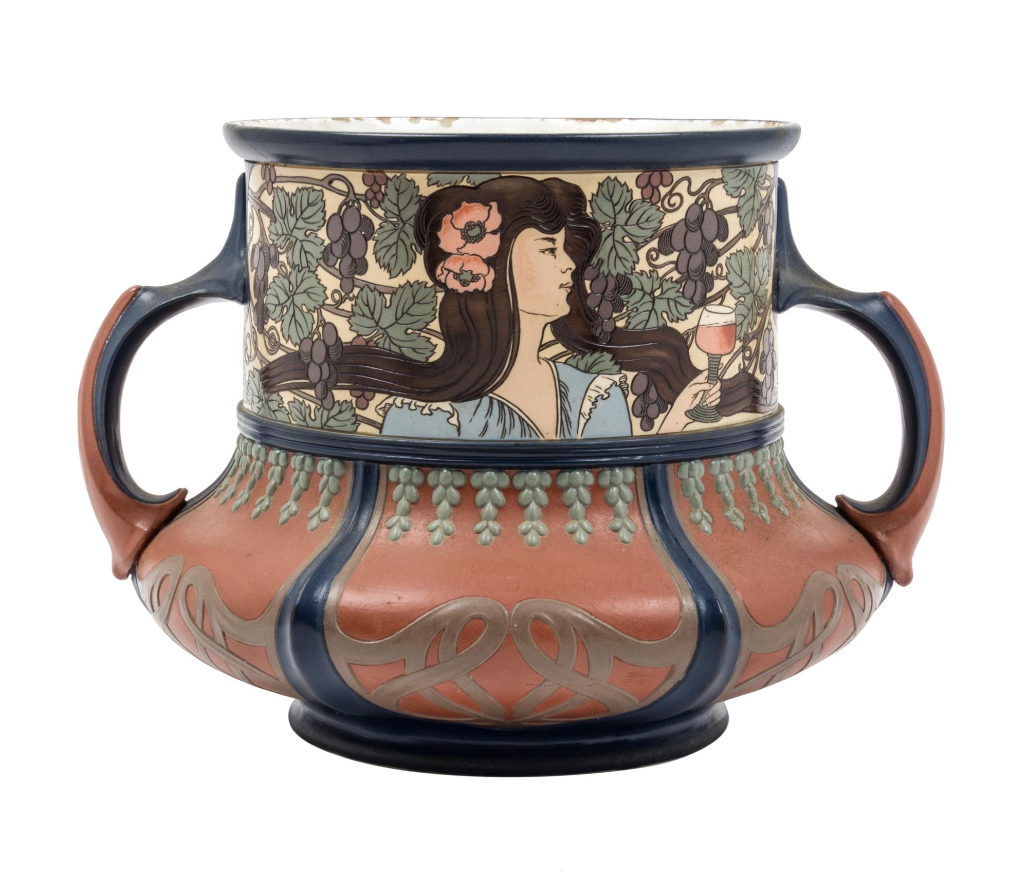 A Mettlach Stoneware Center Bowl Height 9 3/4 inches.